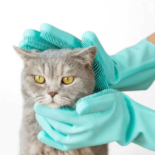 RubbaPaw silicone gloves with bristles cleaning and massaging a cat
